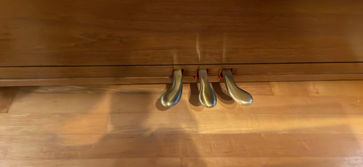 Three brass pedals