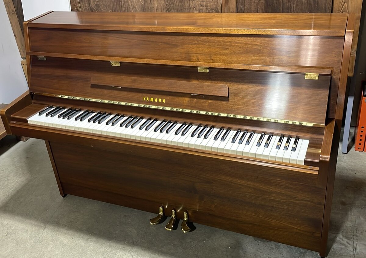 Yamaha M5J upright piano in a walnut cabinet